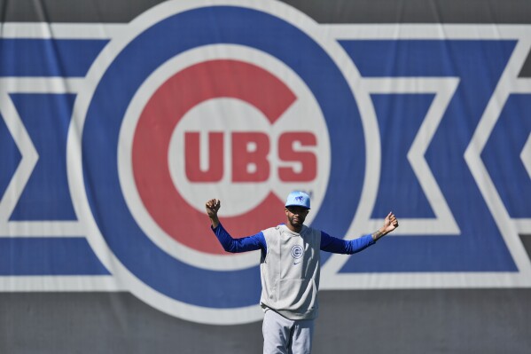 Chicago Cubs' Carl Edwards Jr. stretches during a baseball spring training workout, Saturday, Feb. 17, 2024, in Mesa, Ariz. (AP Photo/Matt York)