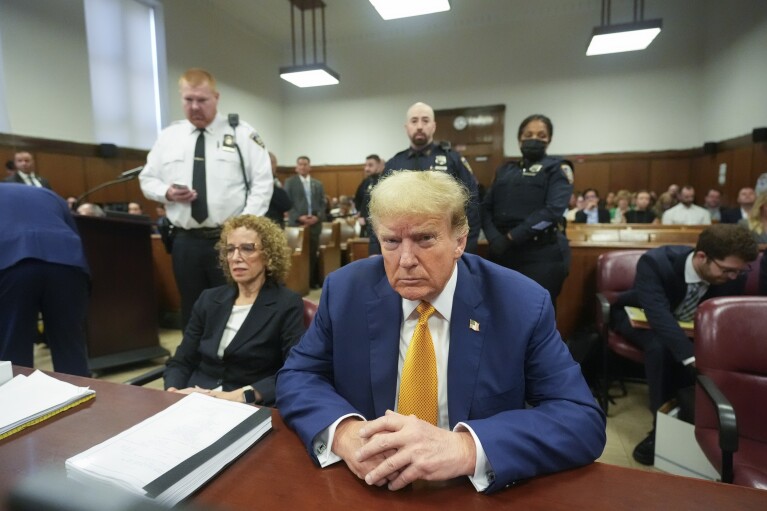 Former President Donald Trump, joined by his attorney Susan Necheles, left, sits at the defense table in Manhattan criminal court, Tuesday, May 7, 2024, in New York. (AP Photo/Mary Altaffer, Pool)