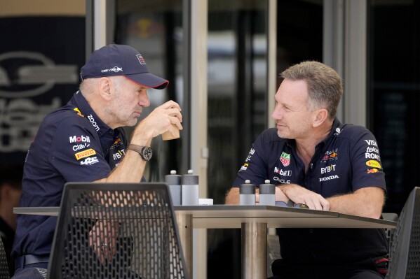 Red Bull team principal Christian Horner, right, has breakfast with Red Bull lead designer Adrian Newey prior to the first practice session ahead of the Formula One Bahrain Grand Prix at the Bahrain International Circuit in Sakhir, Bahrain, Thursday, Feb. 29, 2024. (AP Photo/Darko Bandic)