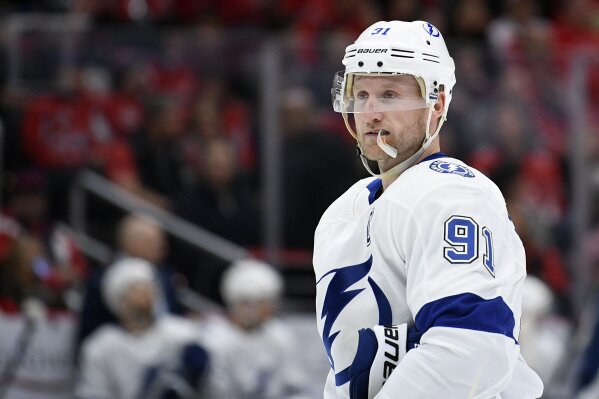 FILE - In this Dec. 21, 2019, file photo, Tampa Bay Lightning center Steven Stamkos (91) looks on during the first period of an NHL hockey game against the Washington Capitals in Washington.] Stamkos will be limited at the start of Tampa training camp because of a new lower-body injury, general manager Julien BriseBois said Saturday, July 11, 2020. (AP Photo/Nick Wass, File)