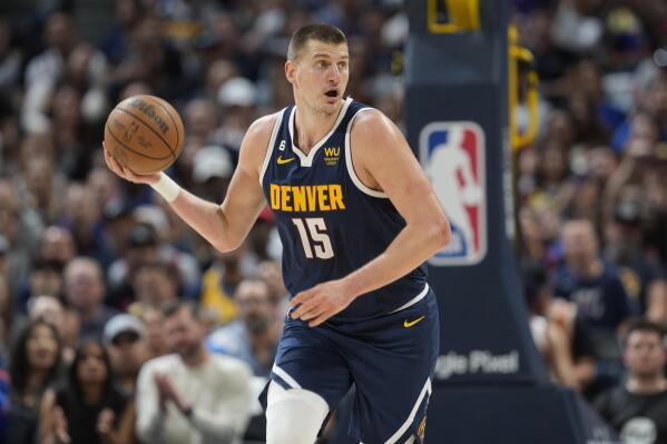 Denver Nuggets center Nikola Jokic picks up the ball in the first half of Game 2 of an NBA second-round playoff series against the Phoenix Suns, Monday, May 1, 2023, in Denver. (AP Photo/David Zalubowski)