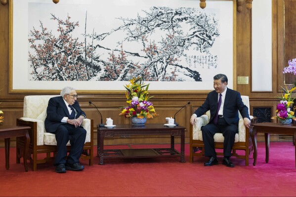 In this photo released by Xinhua News Agency, Chinese President Xi Jinping, right, talks to former U.S. Secretary of State Henry Kissinger during a meeting at the Diaoyutai State Guesthouse in Beijing, Thursday, July 20, 2023. Xi told Kissinger on Thursday that relations between the two countries are at a crossroads and both sides need to "make new decisions" that could result in stable ties and "joint success and prosperity." (Huang Jingwen/Xinhua via AP)