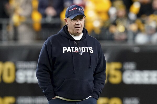 FILE - New England Patriots offensive coordinator Bill O'Brien watches warmups for the team's NFL football game against the Pittsburgh Steelers on Dec. 7, 2023, in Pittsburgh. Ohio State is hiring O'Brien as its offensive coordinator, a person with direct knowledge of the decision told The Associated Press on Thursday night, Jan. 18, 2024. The person spoke on condition of anonymity because the hire still needed university approval, but an announcement was expected as soon as Friday. (AP Photo/Matt Freed, File)
