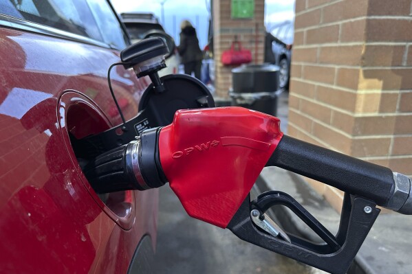 A motorist fills up the tank of a vehicle at a Costco gasoline station late Sunday, Feb. 16, 2025, in Sheridan, Colo. (AP Photo/David Zalubowski, File)
