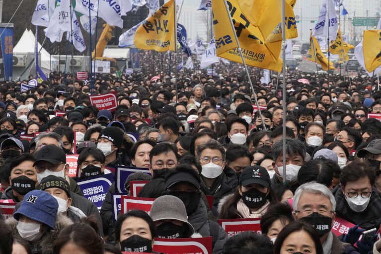 FILE - Doctors stage a rally against the government's medical policy in Seoul, South Korea, on March 3, 2024. A South Korean court ruled in favor of the government's plan to drastically boost medical school admissions on Thursday, May 16, 2024, media reports said. (AP Photo/Ahn Young-joon, File)
