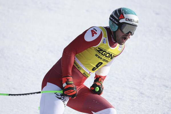 Austria's Vincent Kriechmayr celebrates at the finish area of an alpine ski, men's World Cup downhill race, in Bormio, Italy, Wednesday, Dec.28, 2022. (AP Photo/Alessandro Trovati)