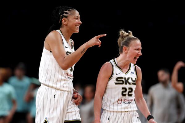 Chicago Sky forward Candace Parker and guard Courtney Vandersloot (22) celebrate at a time out during the second half of a WNBA basketball playoff game against the New York Liberty Tuesday, Aug. 23, 2022, in New York. The Chicago Sky won 90-72. (AP Photo/Noah K. Murray)