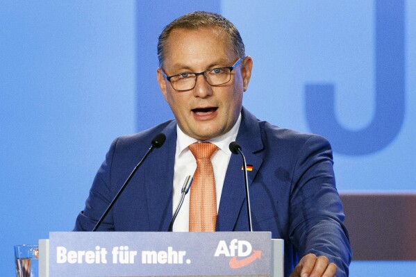 FILE - AfD co-leader Tino Chrupalla speaks at the Alternative for Germany, or AfD, federal party conference at the Magdeburg Messe, Germany, July 28, 2023. Tino Chrupalla, a leader of the far-right Alternative for Germany was given medical treatment and then taken to a hospital shortly before he was due to speak an election rally in Bavaria on Wednesday Oct. 4, 2023, police said. (Carsten Koall/dpa via AP, File)