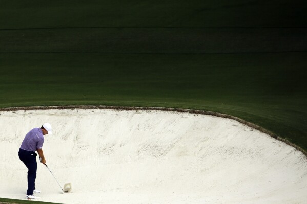 FILE - Jordan Spieth hits out of a bunker on the eighth hole during the second round of the Masters golf tournament Friday, April 10, 2015, in Augusta, Ga. Spieth says this bunker is his least favorite place to be. (AP Photo/David J. Phillip, File)