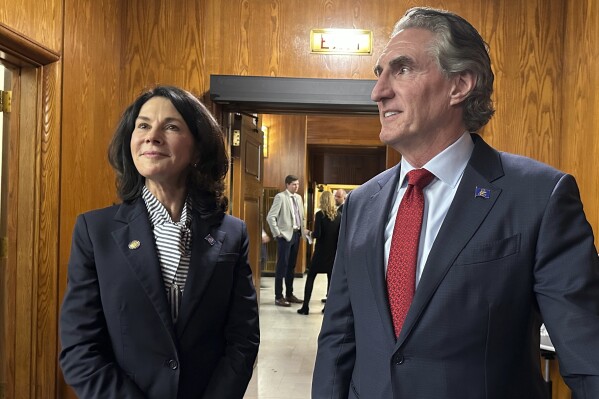 From left, North Dakota Lt. Gov. Tammy Miller and Gov. Doug Burgum stand in the state House of Representatives on Monday, Oct. 23, 2023, before the start of a three-day special session at the state Capitol in Bismarck, N.D. Miller announced her gubernatorial campaign on Thursday, Feb. 15, 2024. Burgum announced last month that he won't seek a third term. (AP Photo/Jack Dura)