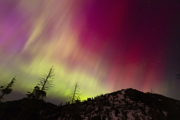 The Northern lights fill the sky at the Bogus Basin ski resort on Saturday, May 11, 2024 in Boise, Idaho. (Kyle Green (AP Photo/Kyle Green)