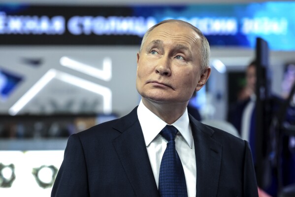 Russian President Vladimir Putin visits the Russia Expo international exhibition and forum at the VDNKh (The Exhibition of Achievements of National Economy) in Moscow, Russia, Sunday, Dec. 17, 2023. (Sergey Fadeichev, Sputnik, Kremlin Pool Photo via AP)