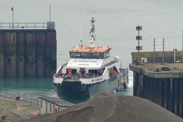 A British Border Force vessel carrying a group of people thought to be migrants rescued after a boat incident in the Channel comes into dock in Dover, England, Monday, Nov. 14, 2022. The U.K. and French interior ministers signed an agreement on Monday that will see more police patrol beaches in northern France in an attempt to stop people trying to cross the English Channel in small boats  — a regular source of friction between the two countries. (Gareth Fuller/PA via AP)