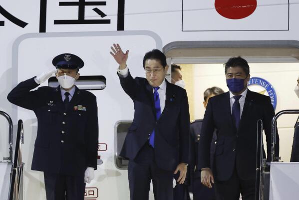 Japanese Prime Minister Fumio Kishida, center, prepares to leave Haneda airport in Tokyo Sunday, Jan. 8, 2023. Kishida begins a weeklong trip Monday to strengthen military ties with Europe and Britain and bring into focus the Japan-U.S. alliance at a summit in Washington, as Japan breaks from its postwar restraint to take on more offensive roles with an eye toward China. (Kota Endo/Kyodo News via AP)