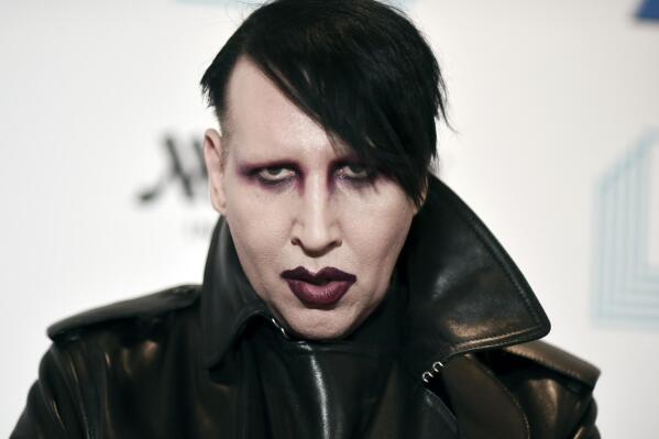 FILE - In this Dec. 10, 2019, file photo, Marilyn Manson attends the 9th annual "Home for the Holidays" benefit concert in Los Angeles. On Friday, July 2, 2021, Manson, born Brian Hugh Warner, turned himself in to law enforcement in Los Angeles, in relation to a 2019 arrest warrant for acts alleged to have occurred while performing a concert in Gilford, NH. Warner was processed and released on personal recognizance bail. (Photo by Richard Shotwell/Invision/AP, File)