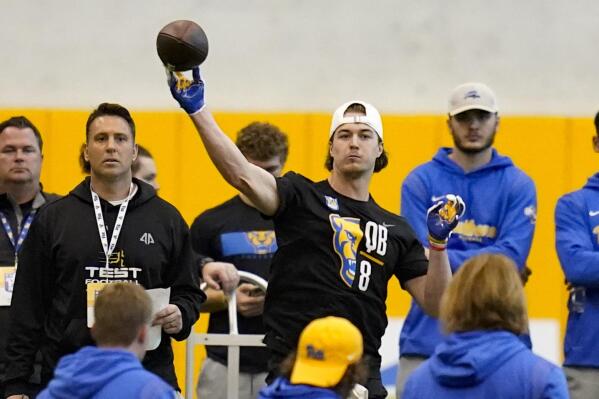 FILE - Quarterback Kenny Pickett (8) goes through passing drills during Pittsburgh's football pro day , Monday, March 21, 2022, in Pittsburgh. Pickett is expected to be taken in the NFL Draft. (AP Photo/Keith Srakocic, File)