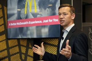 FILE - Chris Kempczinski, then-incoming president of McDonald's USA, speaks during a presentation at a McDonald's restaurant in New York's Tribeca neighborhood, Nov. 17, 2016.  Chris Kempczinski,  the CEO of McDonald's faced increasing criticism Thursday, Nov. 11, 2021 including more calls for resignation, following texts messages he sent to Chicago Mayor Lori Lightfoot where he seemed to blame the deaths of two Black and Latino children killed in gun violence on their parents.  (AP Photo/Richard Drew, File)