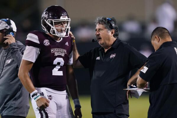 Mississippi State quarterback Will Rogers (2) confers with coach Mike Leach during the second half of the team's NCAA college football game in Starkville, Miss., Saturday, Sept. 11, 2021. (AP Photo/Rogelio V. Solis)