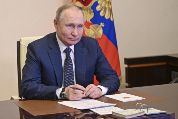 Russian President Vladimir Putin takes part in the launch of a new ferry via a conference call at the Novo-Ogaryovo residence outside Moscow Moscow, Russia, Friday, March 4, 2022. (Andrei Gorshkov, Sputnik, Kremlin Pool Photo via AP)