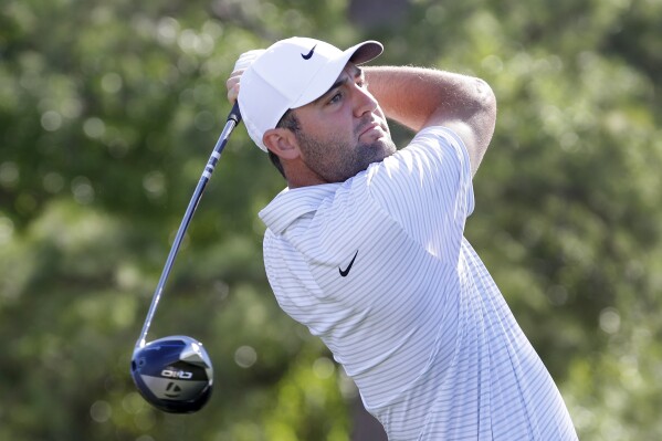 Scottie Scheffler tees off on the first hole during the first round of the Houston Open golf tournament Thursday, March, 28, 2024, in Houston. (AP Photo/Michael Wyke)
