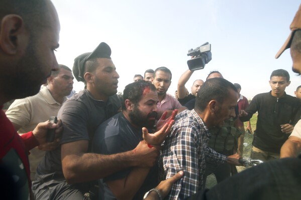 Palestinians and Hamas militants transport Yarden Bibas to Gaza after kidnapping him from his home in Nir Oz, a kibbutz in Israel near the Gaza border, on Oct. 7, 2023. Hamas militants stormed the border with Israel, killed over 1,200 Israelis, and took over 200 hostages. (AP Photo)
