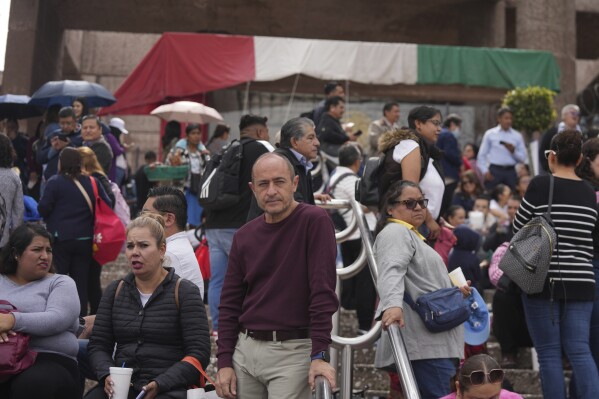 Unionized federal court workers gather outside a federal court as they strike over reforms that would make all judges stand for election in Mexico City, Monday, Aug. 19, 2024. (AP Photo/Fernando Llano)