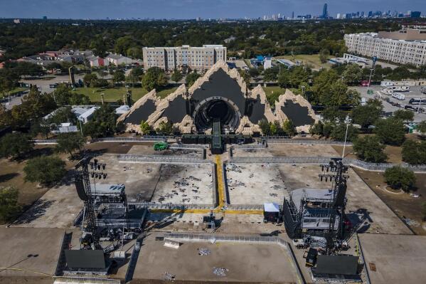 The Astroworld main stage where Travis Scott was performing Friday evening where a surging crowd killed eight people, sits full of debris from the concert,  in a parking lot at NRG Center on Monday, Nov. 8, 2021, in Houston. ( Mark Mulligan/Houston Chronicle via AP)