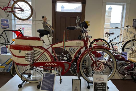 This modified 1953 Schwinn DX that was used in the 1985 film "Pee-wee’s Big Adventure," starring Paul Reubens as Pee-wee Herman, appears at the Bicycle Museum of America in New Bremen, Ohio on Dec. 26, 2022. The museum traces the bike's impact on culture, transportation and plain ol’ fun, showing how it became synonymous with convenience and ease. (Steve Wartenberg via AP)