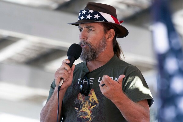 FILE - Alan Hostetter speaks during a pro-Trump election integrity rally he organized at the Orange County Registrar of Voters offices in Santa Ana, Calif., Nov. 9, 2020. Hostetter, a former California police chief convicted of a conspiracy charge in the U.S. Capitol riot was sentenced to more than 11 years in prison on Thursday, Dec. 7, 2023, after giving a speech that praised Republican presidential candidate Vivek Ramaswamy's suggestion the Jan. 6, 2021, attack could have been an 
