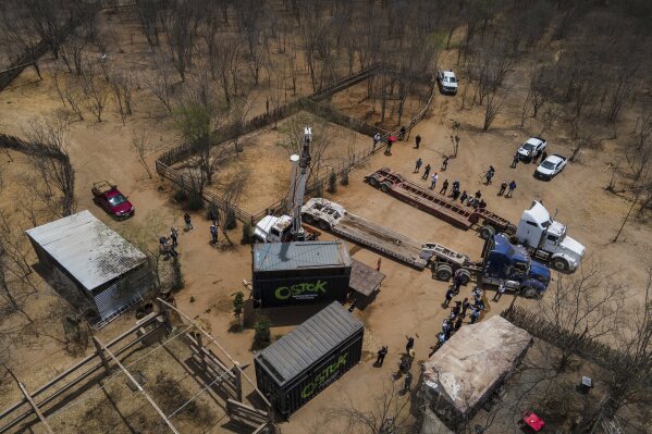 Ostok Sanctuary staff members move animals into trucks to transport them to Mazatlan, Sinaloa state, from the refuge in the outskirts of Culiacan, Sinaloa state, Mexico, Tuesday, May 20, 2025. (AP Photo/Felix Marquez)