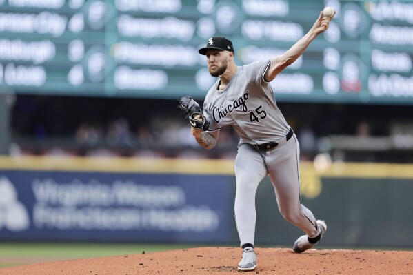 Chicago White Sox pitcher Garrett Crochet throws to a Seattle Mariners batter during the first inning of a baseball game Thursday, June 13, 2024, in Seattle. (AP Photo/John Froschauer)