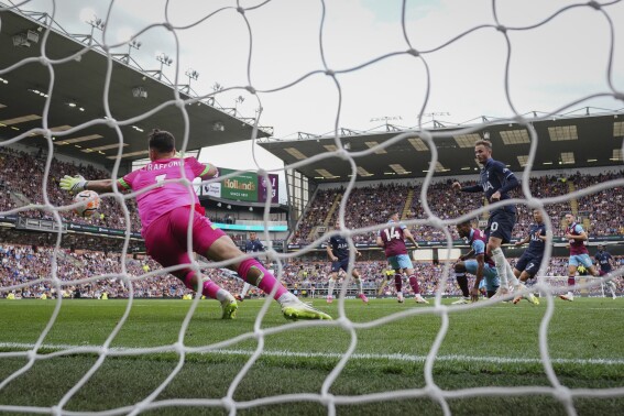 Tottenham's Son Heung-min, second right, scores his side's second goal during the English Premier League soccer match between Burnley and Tottenham Hotspur at Turf Moor stadium in Burnley, England, Saturday, Sept. 2, 2023. (AP Photo/Jon Super)