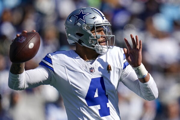 Dallas Cowboys quarterback Dak Prescott passes against the Carolina Panthers during the first half of an NFL football game Sunday, Nov. 19, 2023, in Charlotte, N.C. (AP Photo/Erik Verduzco)