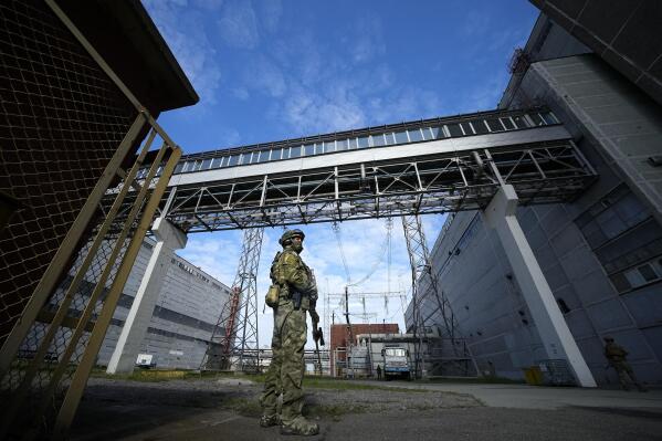 FILE - A Russian serviceman guards an area of the Zaporizhzhia Nuclear Power Station in territory under Russian military control, southeastern Ukraine, May 1, 2022. Ukraine’s Zaporizhzhia nuclear power plant , built during the Soviet era and one of the 10 biggest in the world, has been engulfed by fighting between Russian and Ukrainian troops in recent weeks, fueling concerns of a nuclear catastrophe. (AP Photo, File)