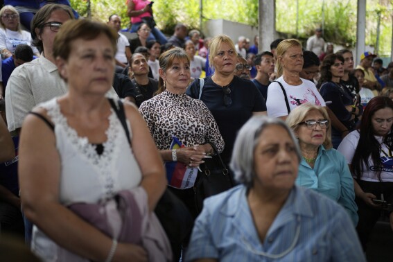Supporters attend former opposition lawmaker Juan Requesens’ gubernatorial campaign kickoff, in Caracas, Venezuela, Tuesday, April 29, 2025. (AP Photo/Ariana Cubillos)