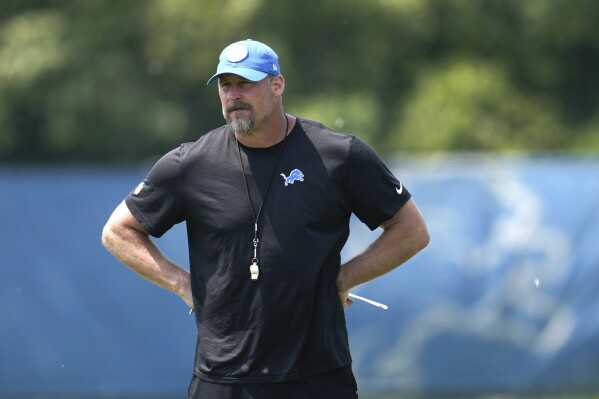 FILE - Detroit Lions head coach Dan Campbell watches during an NFL football practice in Allen Park, Mich., Thursday, June 8, 2023. The Lions are entering the season with the highest expectations they’ve had in years. (AP Photo/Paul Sancya, File)