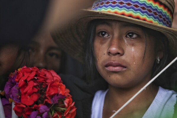 A mourner cries during the wake of Indigenous regional leader Fredy Campo Bomba, in Caldono, Colombia, on July 29, 2023. Campo Bomba was killed by unidentified gunmen on July 26. (AP Photo/Andres Quintero)