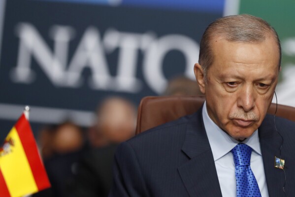 FILE - Turkish President Recep Tayyip Erdogan waits for the start of a round table meeting of the North Atlantic Council during a NATO summit in Vilnius, Lithuania, on July 11, 2023. Turkish President Recep Tayyip Erdogan has submitted a protocol for Sweden’s admission into NATO to Turkey’s parliament for ratification, his office said Monday, Oct. 23, 2023. Erdogan had been delaying ratification of Sweden’s membership, accusing Stockholm of being too soft on Kurdish militants and other groups he considers to be security threats. (AP Photo/Mindaugas Kulbis)