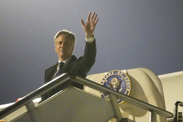 U.S. Secretary of State Antony Blinken waves as he prepares to return to the U.S. following a visit to China, Friday, April 26, 2024, at Beijing Capital International Airport in Beijing, China. (AP Photo/Mark Schiefelbein, Pool)