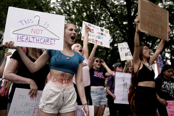 FILE - People rally in support of abortion rights, July 2, 2022, in Kansas City, Mo. On Wednesday, Aug. 30, 2023, St. Louis resident Jamie Corley, who is a Republican, proposed exceptions to the state's near-total abortion ban in cases of rape, incest and up until “fetal viability.” (AP Photo/Charlie Riedel, File)