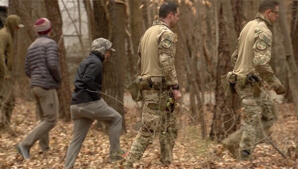 FBI agents search a neighborhood in Chapel Hill, North Carolina on Wednesday, Feb. 5, 2025., where Teresa Youngblut and Felix Bauckholt, who were involved in the shooting death of a U.S. Border Patrol agent in Vermont, had been renting homes, their landlord told The Associated Press. (WRAL-TV via AP)