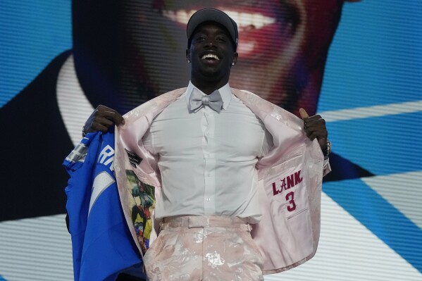 Alabama cornerback Terrion Arnold poses after being chosen by the Detroit Lions with the 24th overall pick during the first round of the NFL football draft, Thursday, April 25, 2024, in Detroit. (AP Photo/Jeff Roberson)