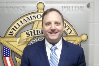 In this Sept. 28, 2020, booking photo provided by the Williamson County, Texas, Sheriff's office shows Sheriff Robert Chody, who was booked into his jail Monday, Sept. 28, 2020, on a $10,000 bond. A grand jury indicted the Texas sheriff Monday on charges accusing him of destroying or concealing video in an investigation into the death of Javier Ambler, a Black man who died in police custody last year. Chody is facing the third-degree felony charge that is punishable by up to 10 years in prison. (Williamson County Sheriff via AP)