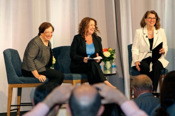 U.S. Supreme Court Justice Elena Kagan, left, sits onstage for a panel at the 9th Circuit Judicial Conference on Thursday, August 3, 2023, in Portland, Ore., with California bankruptcy lawyer Misty Perry Isaacson, center, and Madeleine C. Wanslee, a U.S. Bankruptcy Judge for the District of Arizona. Justice Kagan publicly declared her support for an ethics code for the Supreme Court during the panel but said there was no consensus among the justices on how to proceed. (AP Photo/Claire Rush)