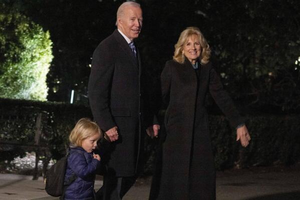 President Joe Biden, first lady Jill Biden, and grandson Beau walk across the South Lawn to board Marine One at the White House in Washington, Friday, Dec. 16, 2022, for a short trip to Andrews Air Force Base, Md., and then on to Wilmington, Del. (AP Photo/Andrew Harnik)