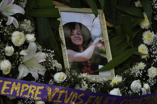A framed image of Ximena Guzmán, the personal secretary to Mexico City Mayor Clara Brugada who was murdered a day earlier, adorns an altar during a wake at a funeral home in Mexico City, Wednesday, May 21, 2025. (AP Photo/Marco Ugarte)