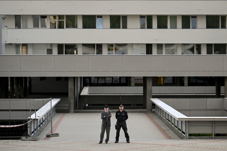 Policemen stand outside the F. D. Roosevelt University Hospital, where Slovak Prime Minister Robert Fico, who was shot and injured, is treated in Banska Bystrica, central Slovakia, Wednesday, May 15, 2024. Slovak Prime Minister Robert Fico is in life-threatening condition after being wounded in a shooting after a political event Wednesday afternoon, according to his Facebook profile.(AP Photo/Denes Erdos)