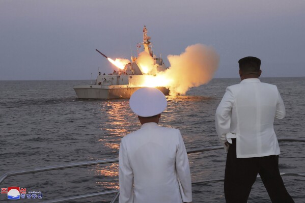 In this undated photo provided on Monday, Aug. 21, 2023, by the North Korean government, North Korean leader Kim Jong Un, right, observes what it says the test-firing of strategic cruise missiles. Independent journalists were not given access to cover the event depicted in this image distributed by the North Korean government. The content of this image is as provided and cannot be independently verified. Korean language watermark on image as provided by source reads: 