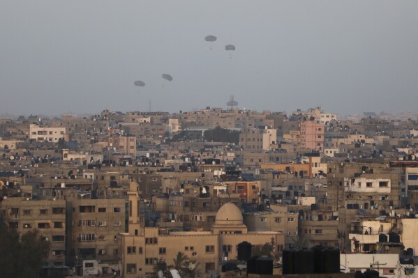 Humanitarian aid is dropped by the United States over Gaza City, Gaza Strip, on Saturday, March 2, 2024. (APPhoto/Mohammed Hajjar)