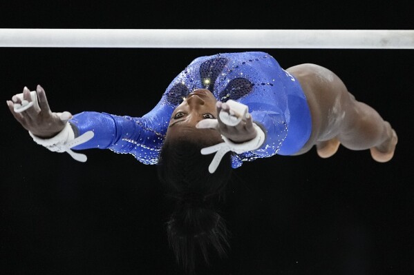 United States' Simone Biles competes in the uneven bars during the women's all-round final at the Artistic Gymnastics World Championships in Antwerp, Belgium, Oct. 6, 2023. (AP Photo/Virginia Mayo)